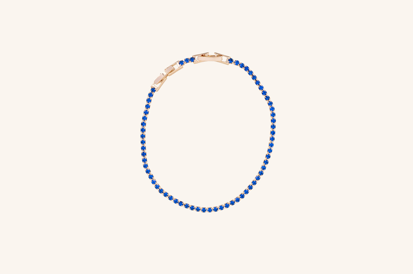 Brățară placată cu aur 18 K Celine, model tenis cu pietre albastre, lungime 17 cm cu o prelungire de 2 cm 