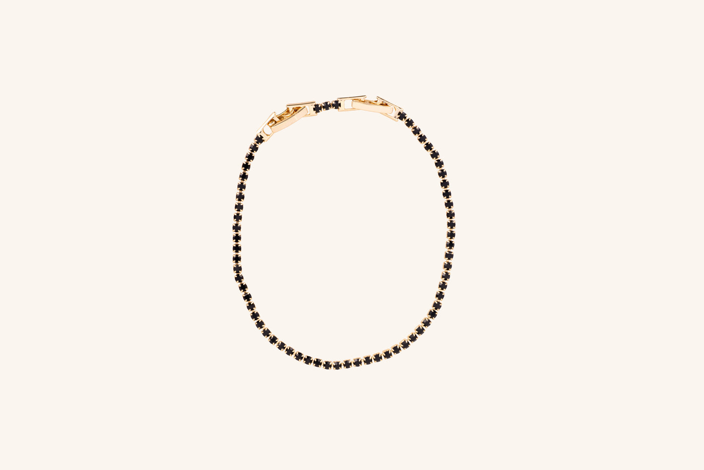 Brățară placată cu aur 18 K Celine, model tenis cu pietre negre, lungime 17 cm cu o prelungire de 2 cm 