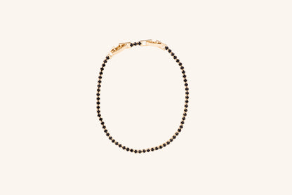 Brățară placată cu aur 18 K Celine, model tenis cu pietre negre, lungime 17 cm cu o prelungire de 2 cm 