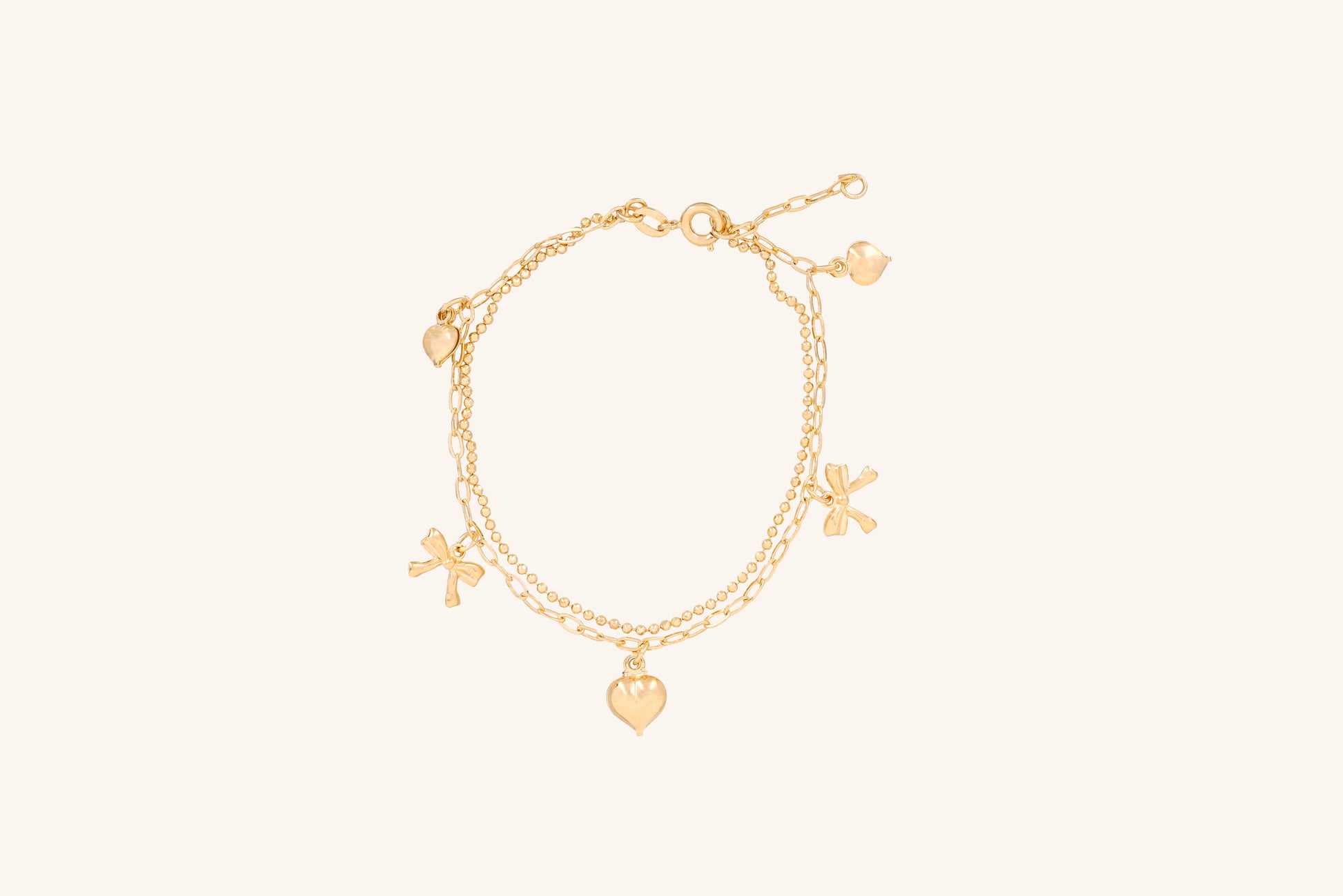 Brățară placată cu aur 18 K Clarisa, model cu pandantive in forma de inima si fundita, lungime 17,5 cm cu o prelungire de 2 cm