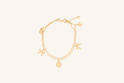 Brățară placată cu aur 18 K Clarisa, model cu pandantive in forma de inima si fundita, lungime 17,5 cm cu o prelungire de 2 cm